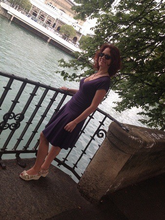 Woman wearing Anatomie Monika dress in Zurich, highlighting stylish travel clothes for Europe.