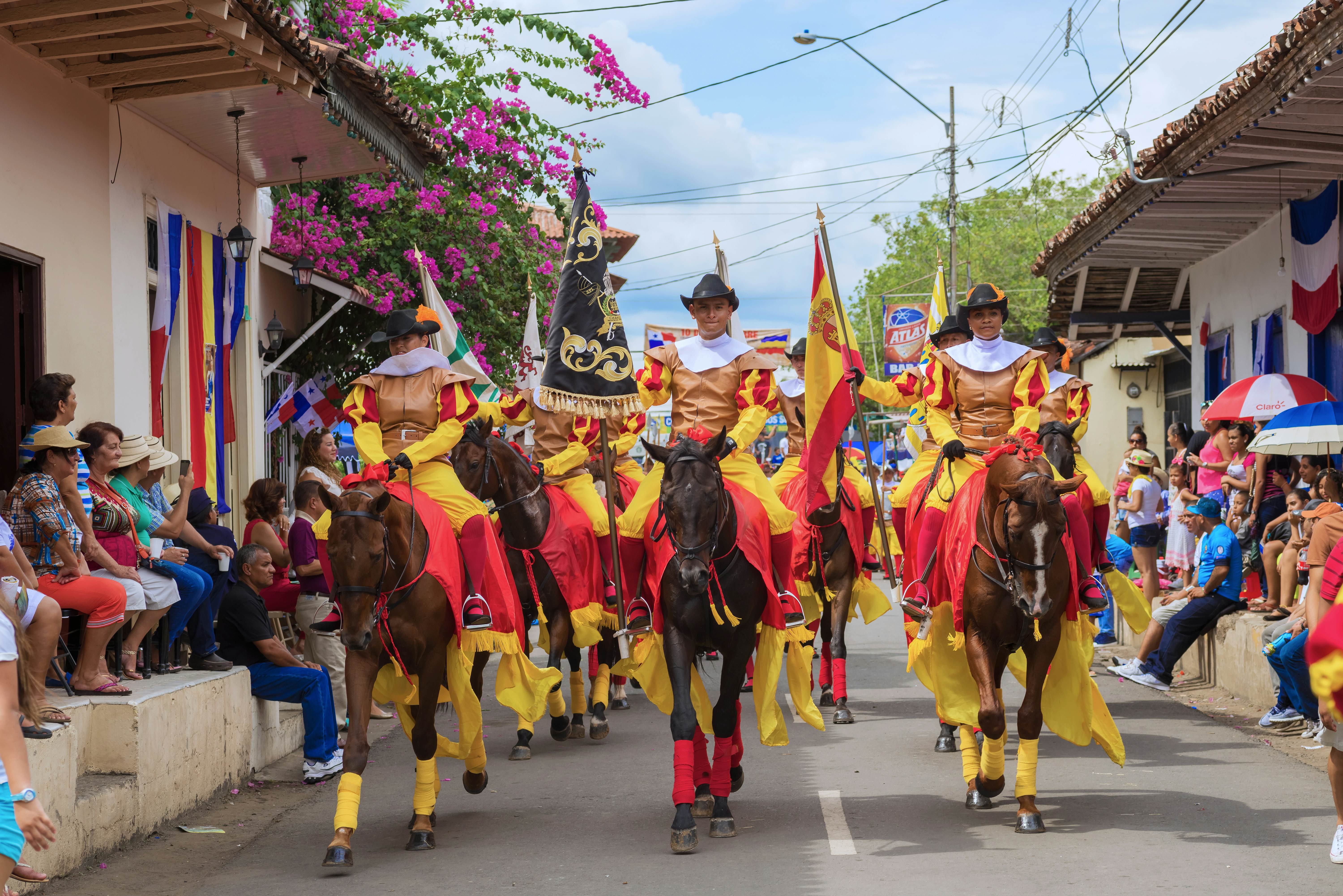 A vibrant festival parade in La Villa de los Santos, Panama, celebrating local culture and traditions during the rainy season.