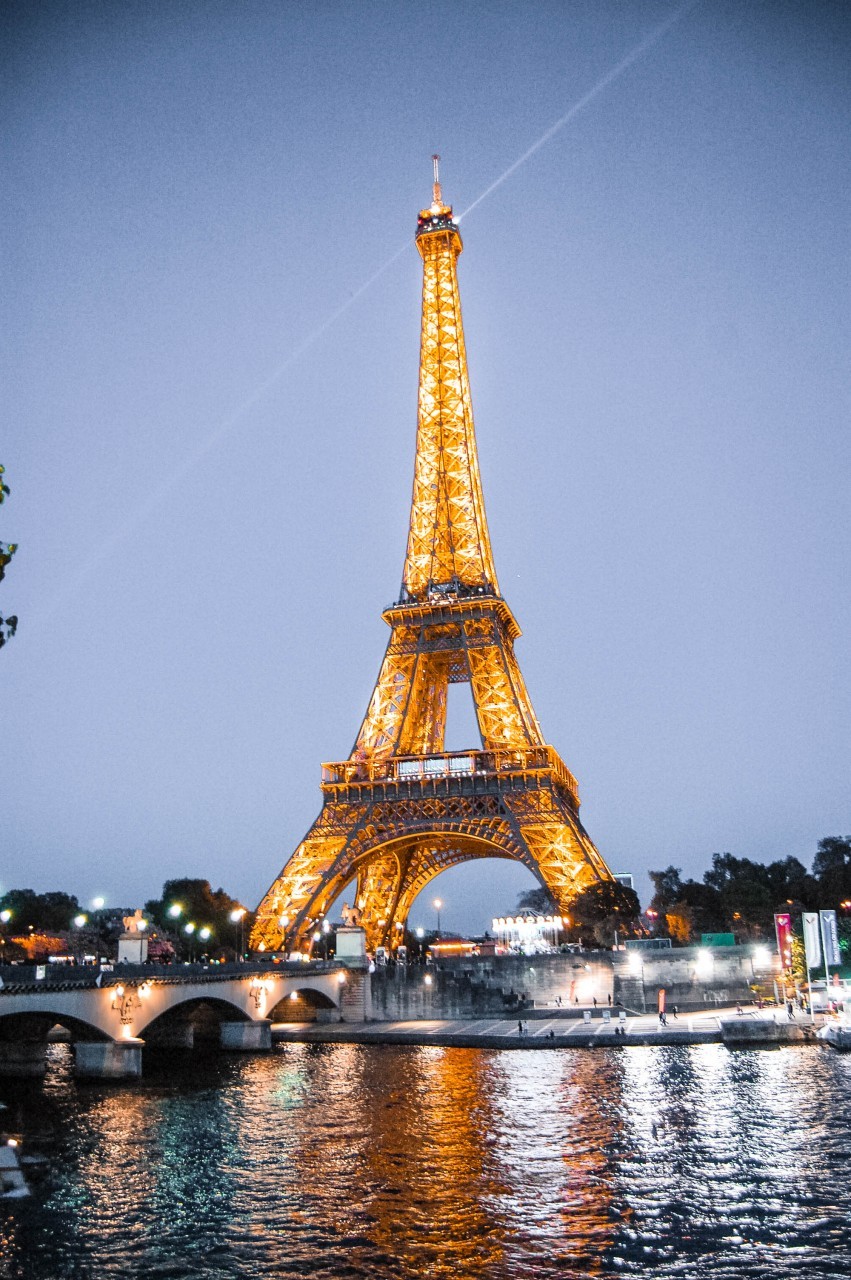 The Eiffel Tower illuminated at night, creating a magical Parisian scene.