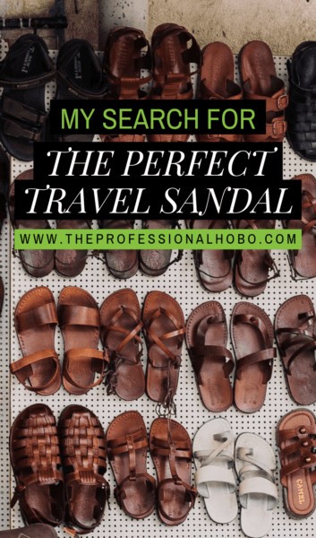 Woman standing on a cobblestone street wearing stylish black travel sandals.