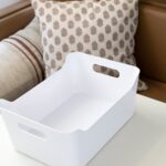 Plastic bins for dinette storage in a travel trailer