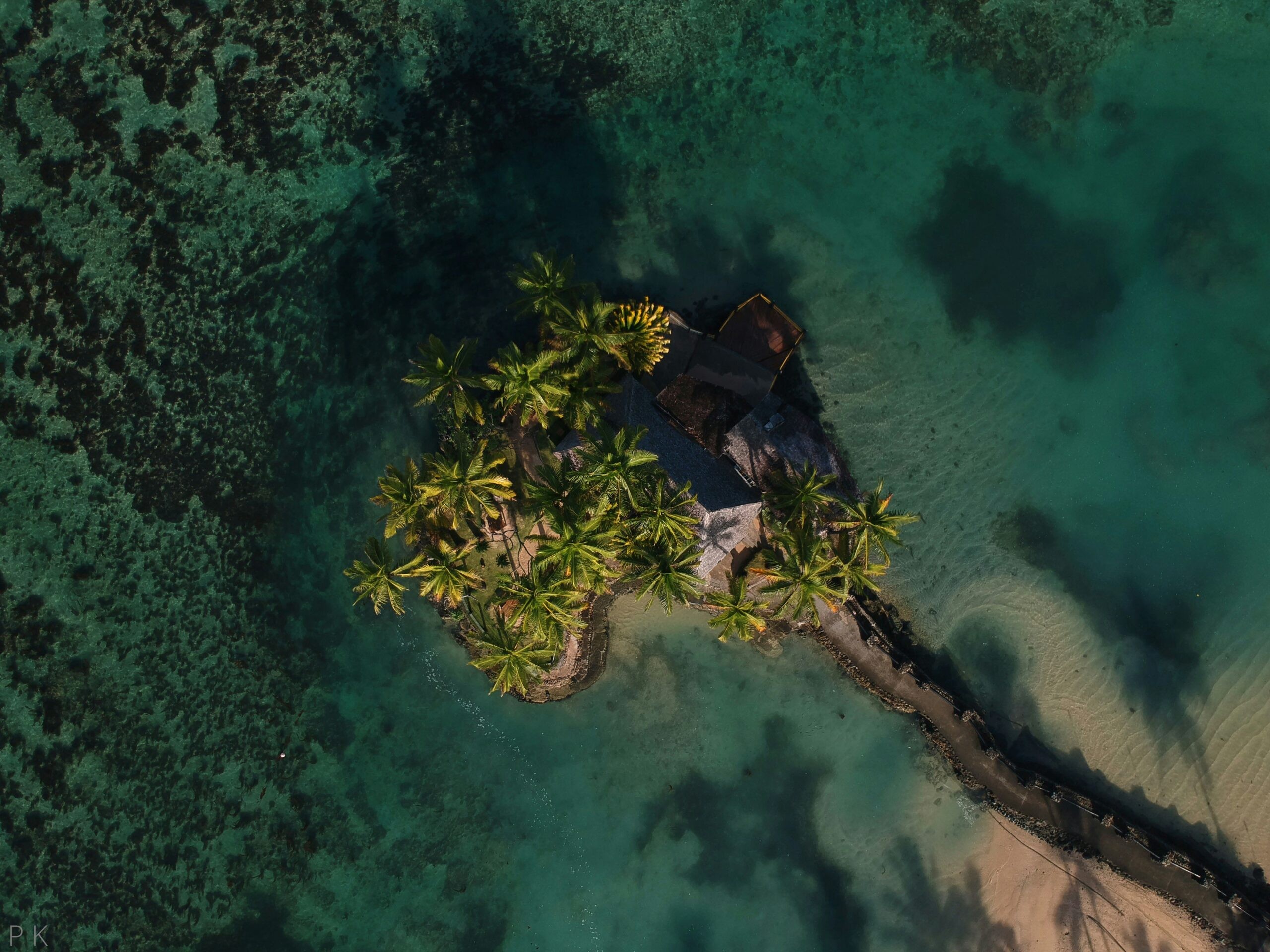 Luxurious overwater bungalows at a resort in Fiji, showcasing a tropical paradise perfect for a relaxing anniversary beach vacation