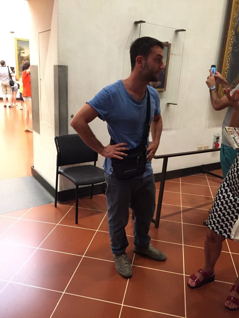 Stylish Italian man confidently carrying a man bag, demonstrating European fashion and practicality