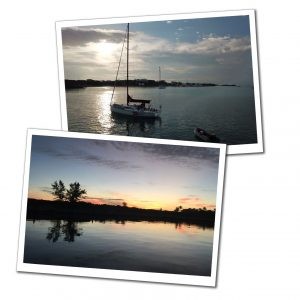 A red hot yacht sailing on the sea at sunset, symbolizing adventure and budget travel through yachting