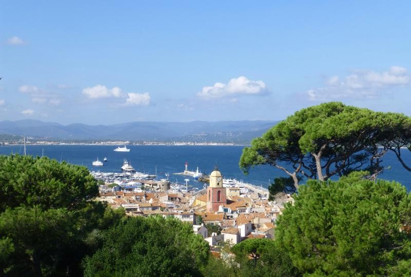 Luxury yachts in Saint-Tropez harbor, France, a premium travel spot known for glamorous beaches and vibrant nightlife.