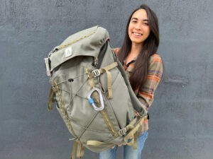 Abigail Bliss holding her Salkan Carry-On Backpack