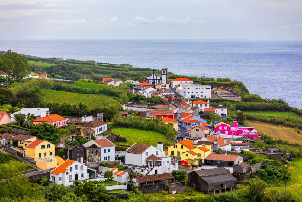 Beautiful nature view on Azores with small villages, towns, green nature fields. Amazing Azores. View of typical Azores village in Sao Miguel island, Azores, Portugal.