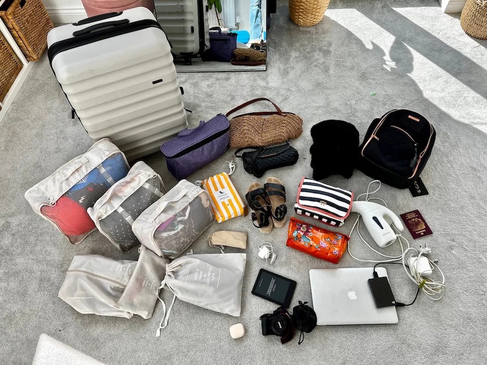 Packing for a cruise, including a travel steamer as an essential item for wrinkle-free clothing