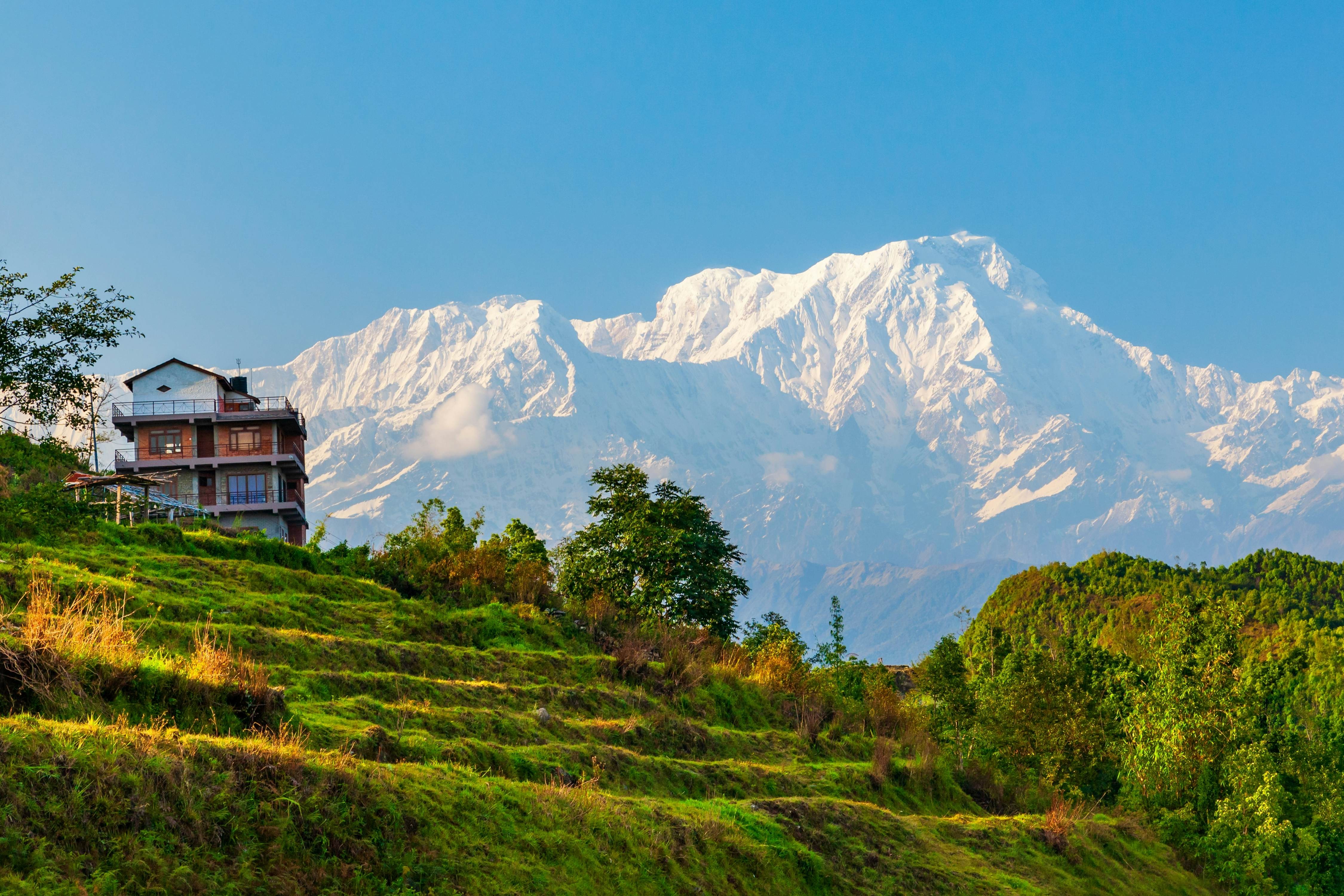 Pokhara, Nepal, nestled against a backdrop of snow-capped mountains, offers stunning views and a peaceful atmosphere