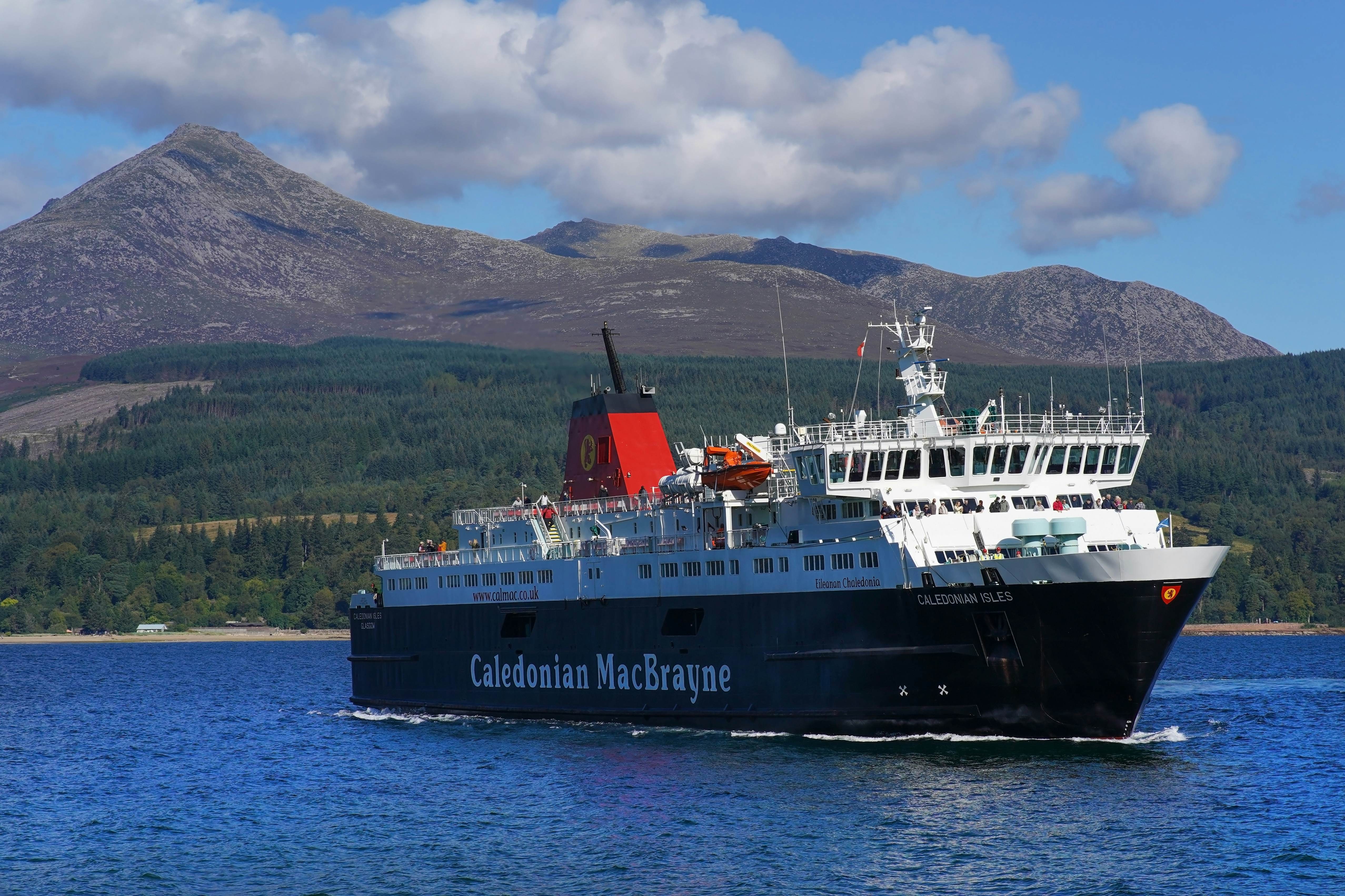 The Calmac ferry Caledonian Isles approaching the pier of Brodick harbor on the Isle of Arran, Scotland