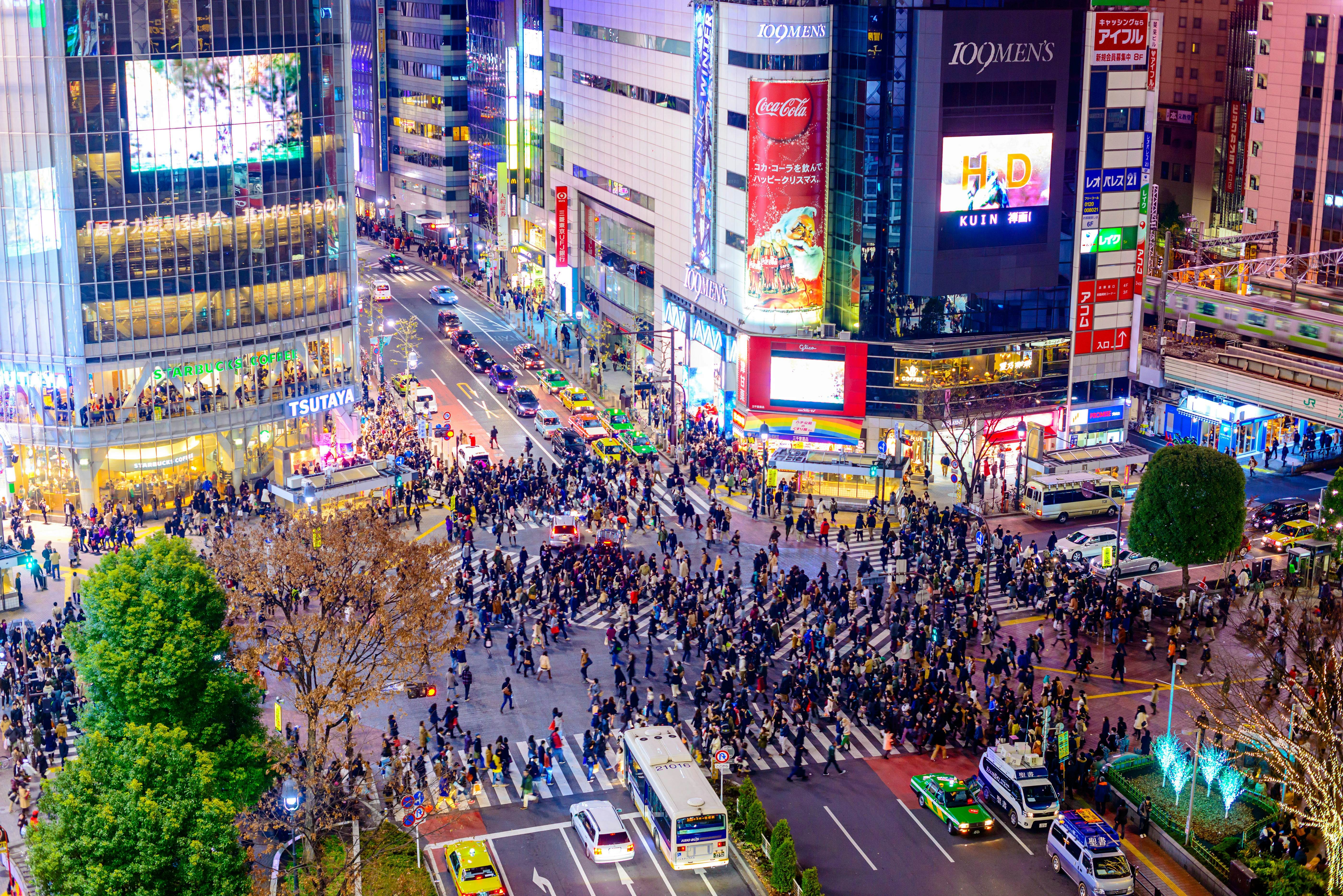 Tokyo, Japan, Shibuya Crossing bustling with pedestrians, a symbol of the city's dynamic energy and modern urban life