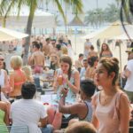 People enjoying festive fun at Tanjong Beach Club in Sentosa, Singapore