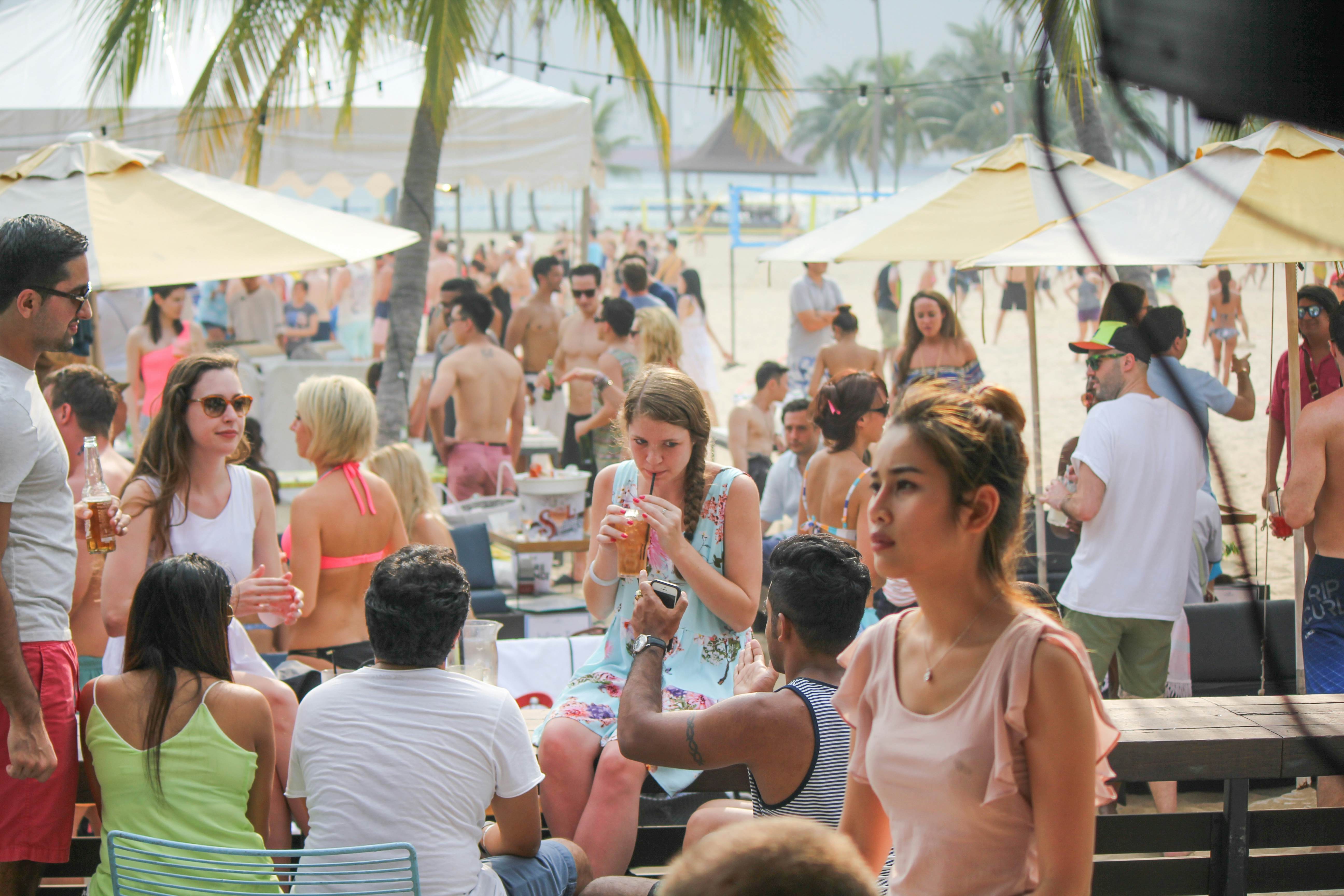 People enjoying festive fun at Tanjong Beach Club in Sentosa, Singapore