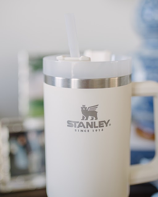 Stanley Adventure Quencher Travel Tumbler 40 oz. in cream, granite, and other colors, showcasing the range of options