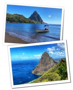 A panoramic view of the iconic Pitons of St. Lucia, standing majestically at the edge of a tropical bay