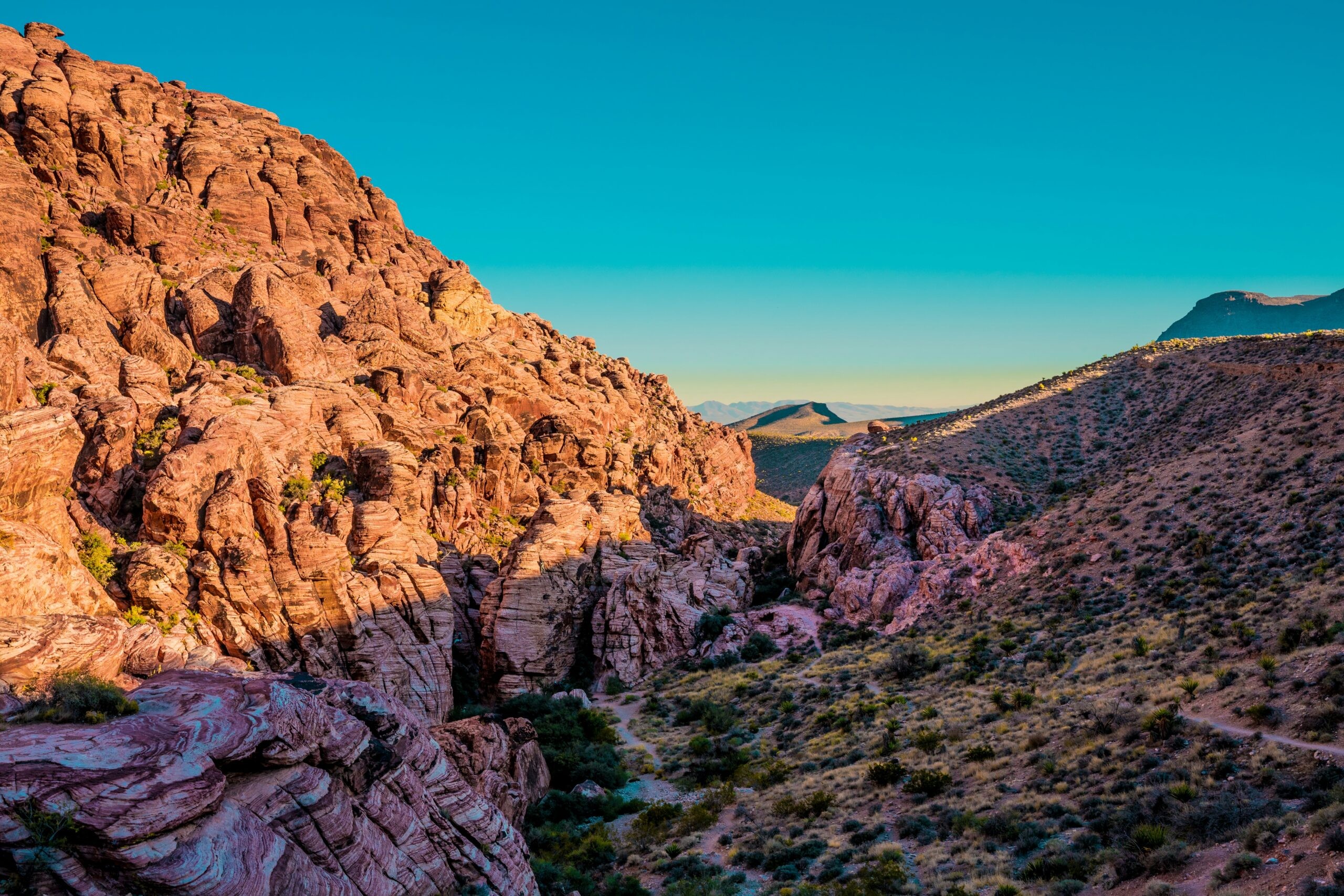 Vibrant red rock formations in Arizona bathed in warm sunlight, suggesting adventure and natural beauty for an anniversary trip