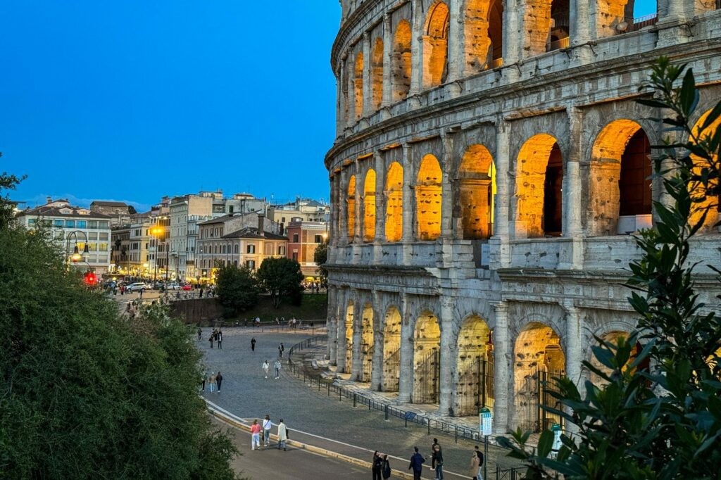 The Colosseum illuminated at dusk in Rome