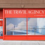 The Travel Agency dispensary exterior in Brooklyn, showcasing its storefront on Flatbush Avenue.