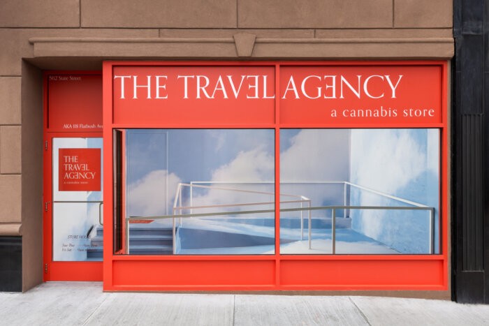 The Travel Agency dispensary exterior in Brooklyn, showcasing its storefront on Flatbush Avenue.