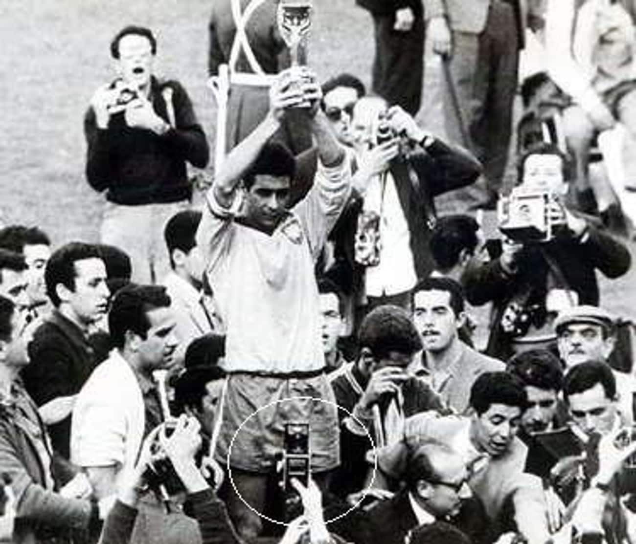 A photo from the 1962 World Cup showing a man in the crowd seemingly holding a device resembling a modern cell phone, prompting time travel theories.