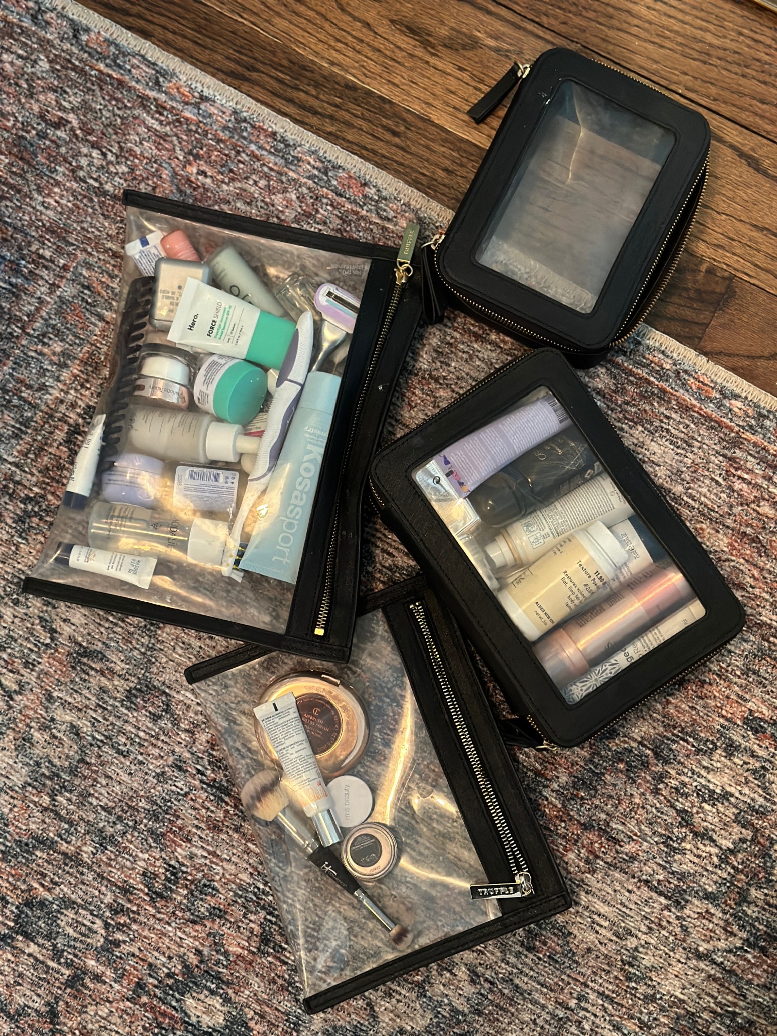 Organized travel cases with toiletries, illustrating a toiletries packing list