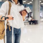 Smiling family looking at map in airport