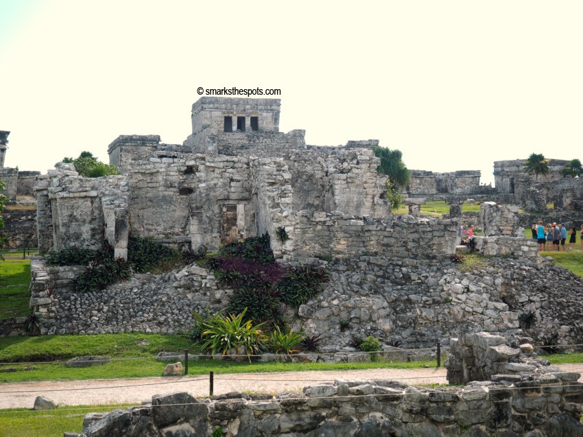 Close-up of ancient stone structures within the Tulum archaeological site, showcasing the historical significance of Mexico travel spots.