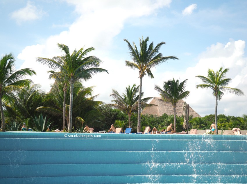 Tranquil beach setting at Zen Serenity Resort, ideal for relaxation and wellness retreats in Mexico travel spots like Tulum.