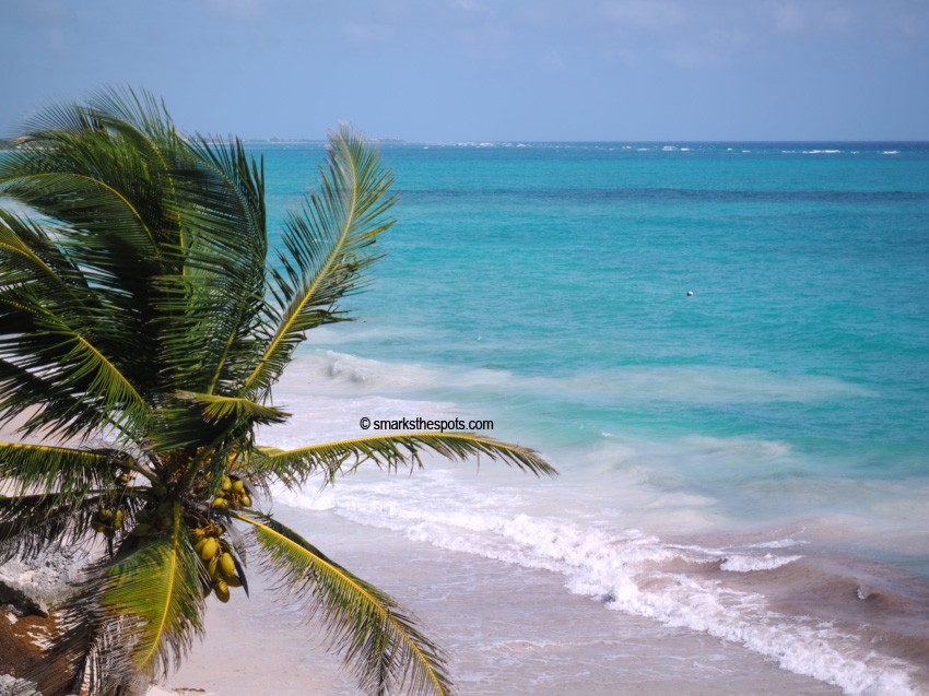 Panoramic view of Tulum Mayan Ruins perched on a cliff overlooking the Caribbean Sea, a prime example of historical Mexico travel spots.