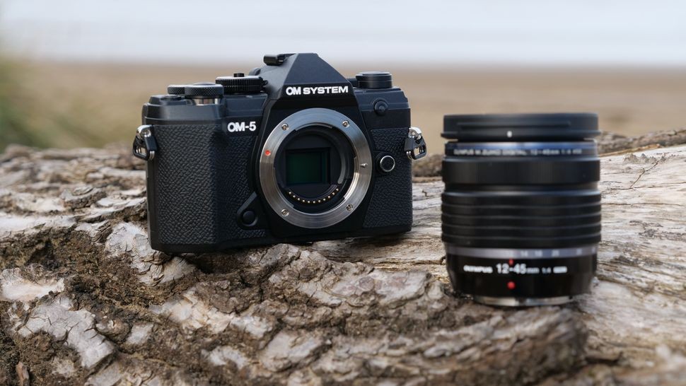 Multiple product shots of the OM System OM-5 camera showcasing its compact design and versatile features