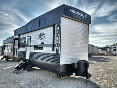 Exterior view of a Keystone RV Hideout 2 story travel trailer showcasing its spacious design.