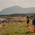 image, solo traveler and companion hiking