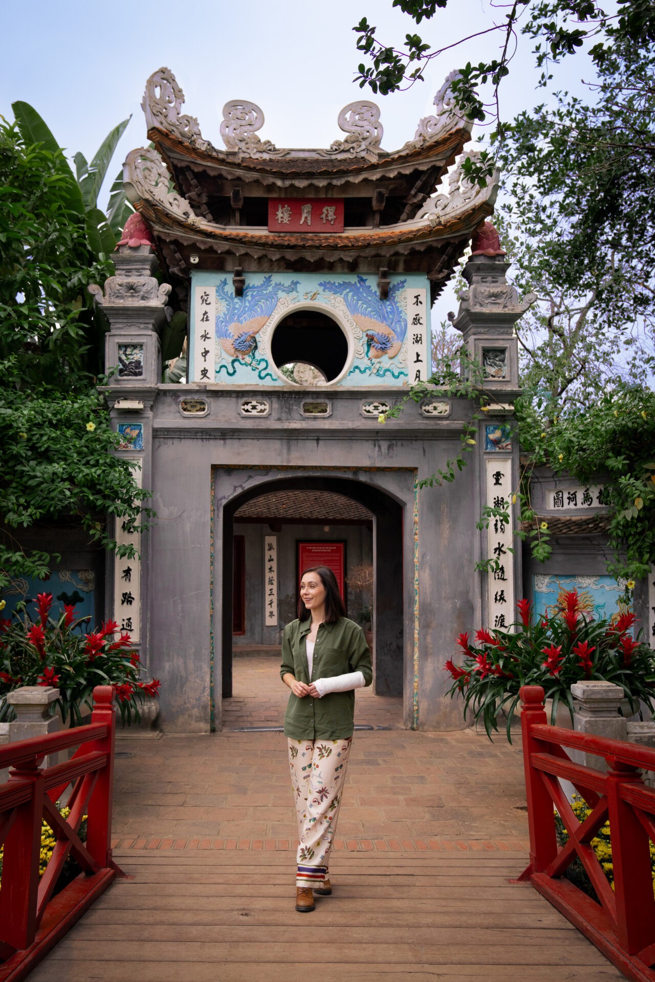 Travel blogger Jordan Gassner near Ngoc Son Pagoda in Hanoi, Vietnam, visiting a temple in Hanoi during her trip - Vietnam travel blog 2024