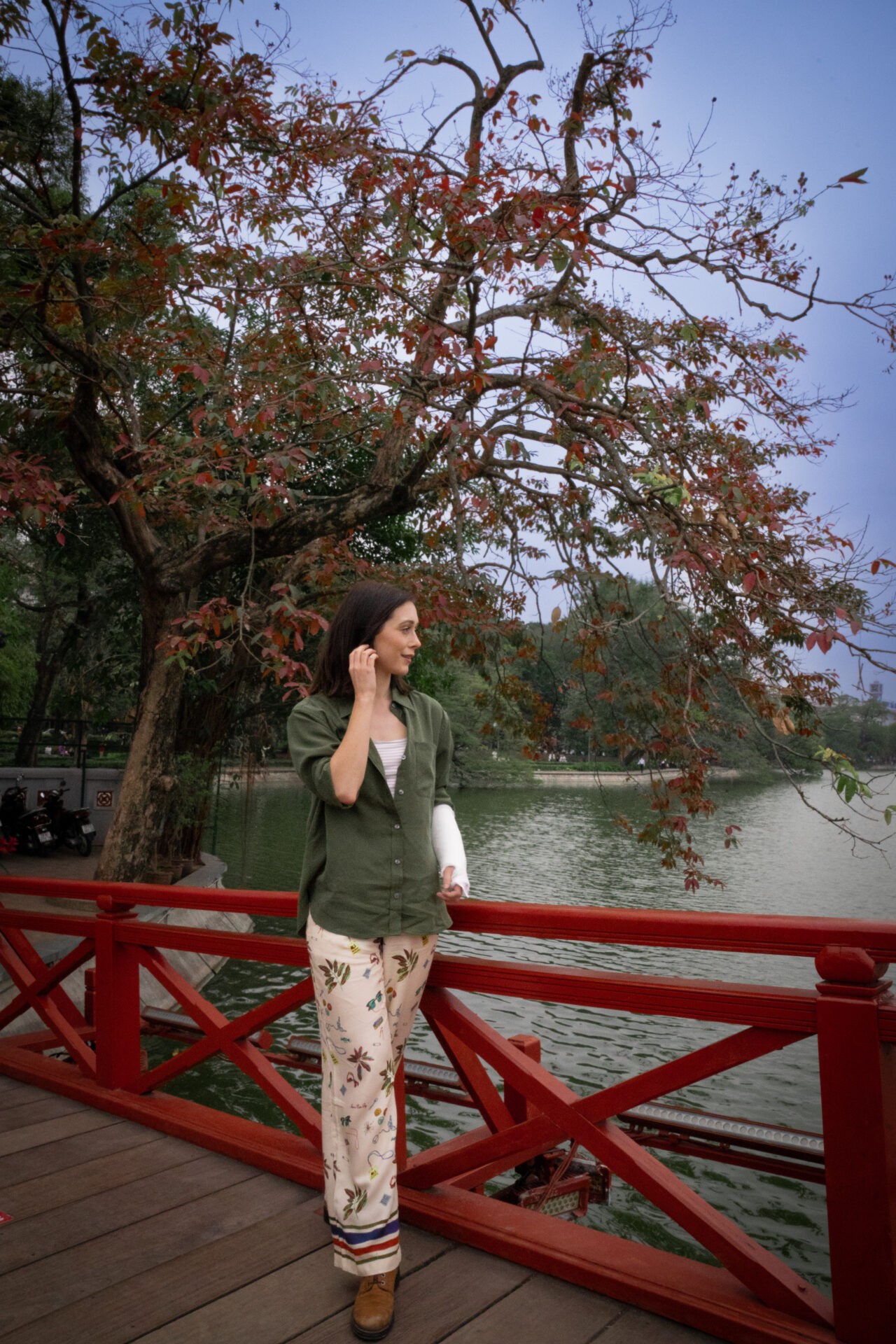 Travel blogger Jordan Gassner overlooking Hoan Kiem Lake in Hanoi, Vietnam, enjoying the scenic views of Hanoi - Vietnam travel blog 2024