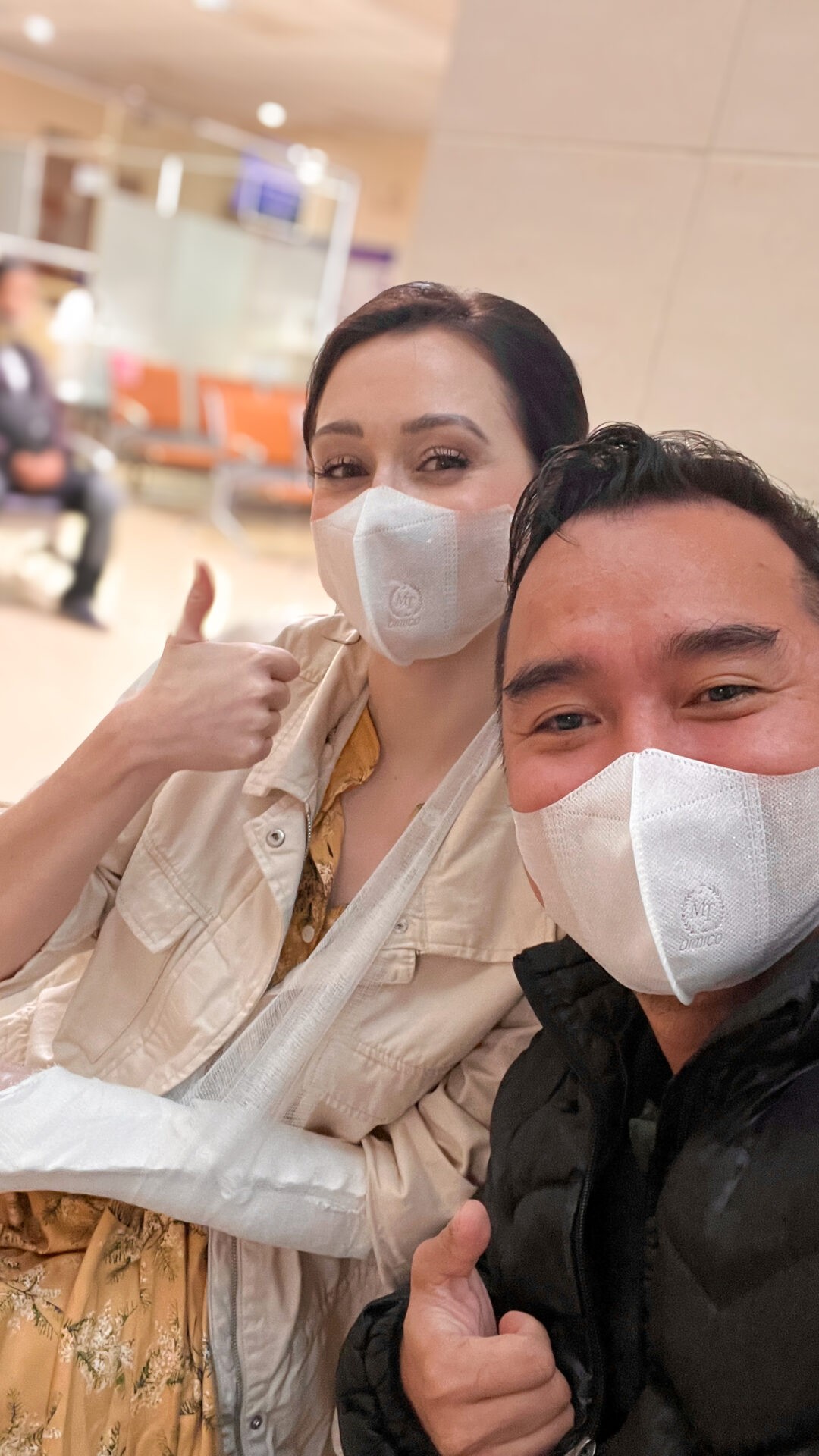 Travel blogger Jordan Gassner taking a selfie with her tour guide in a hospital in Hue, Vietnam, maintaining a positive attitude despite a travel mishap - Vietnam travel blog 2024