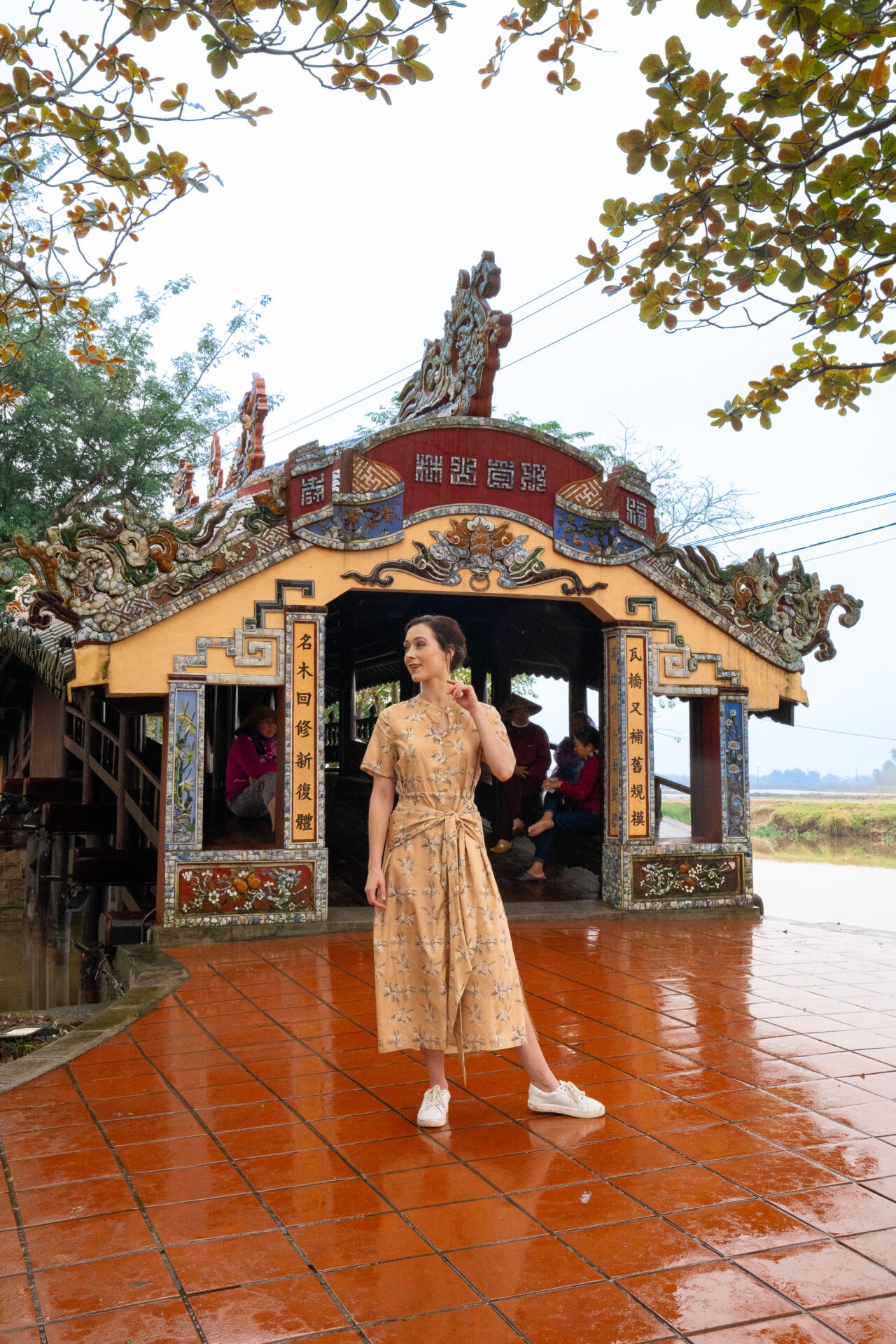 Travel blogger Jordan Gassner posing on Thanh Toan Bridge in Hue, Vietnam, showcasing the beauty of the ancient city - Vietnam travel blog 2024