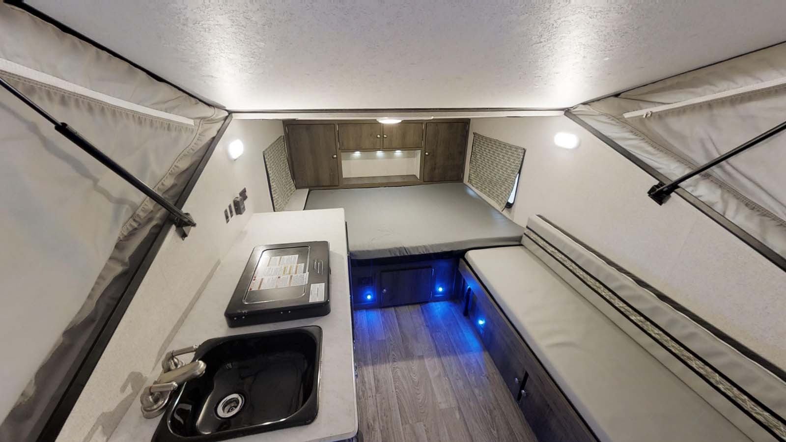 Coachmen Viking Express 12.0TD XL pop-up camper, highlighting its solid walls and spacious interior