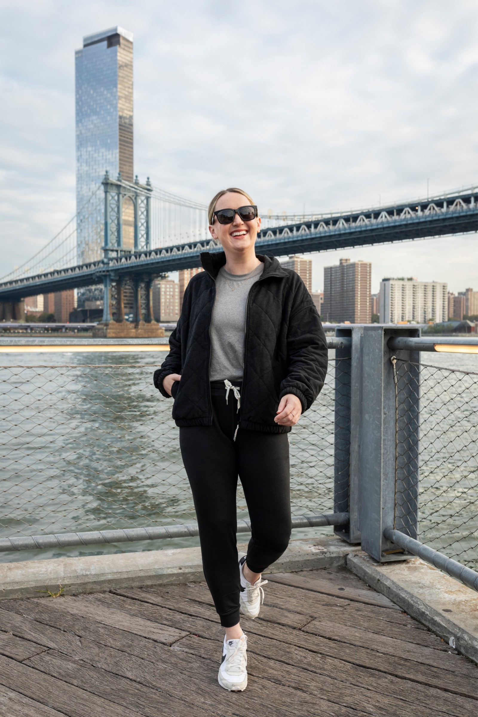 Close-up of grey Vuori joggers folded neatly, highlighting the fabric and drawstring waist, emphasizing their comfort and practicality as travel pants