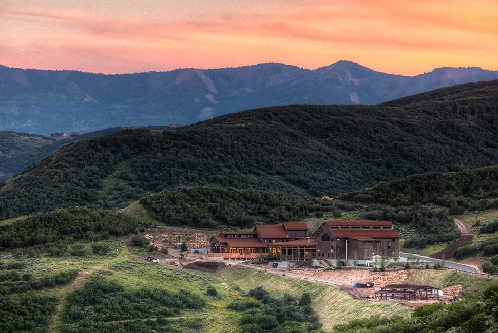 Exterior view of The Lodge at Blue Sky, Auberge Resorts Collection, showcasing its mountain setting and architecture