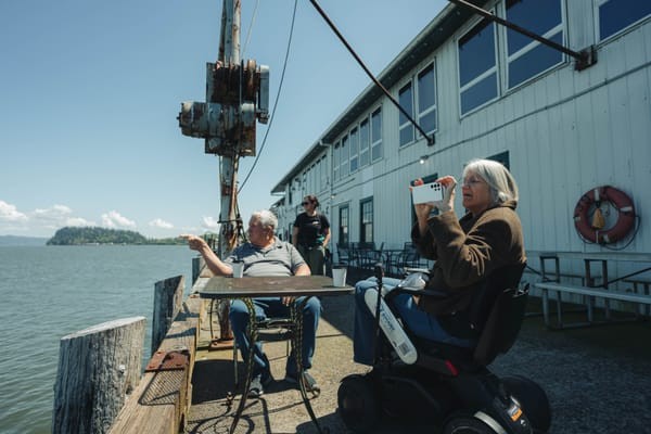 Wheelchair-user and partner enjoying Astoria, Oregon