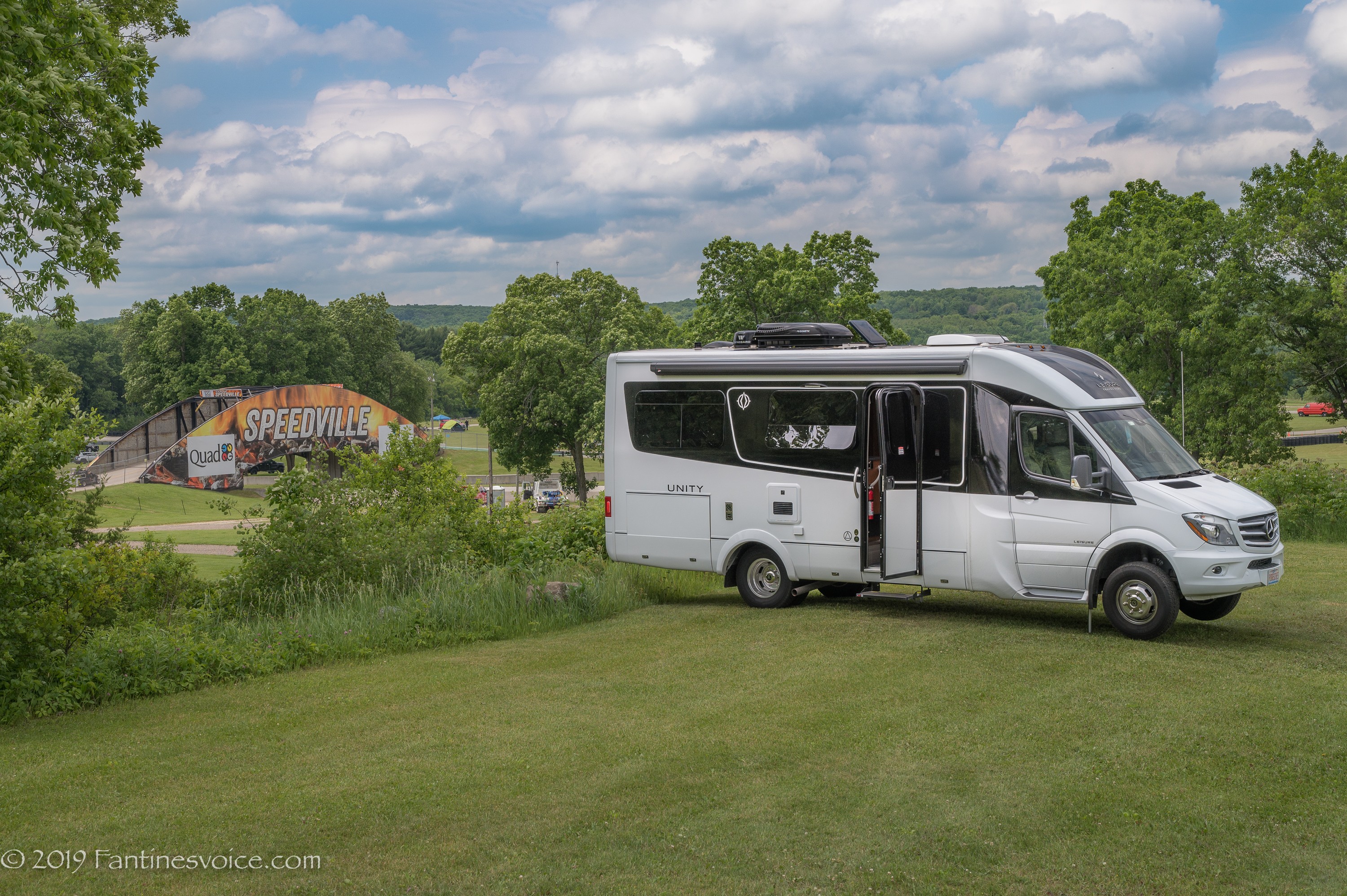 Scenic landscape view from a Unity travel van, highlighting the joy of RV travel and exploration.