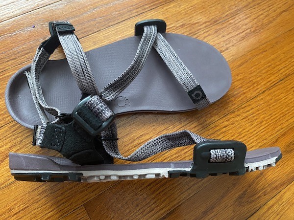 Xero Z-Trail EV barefoot travel sandals in blue, highlighting their lightweight design.