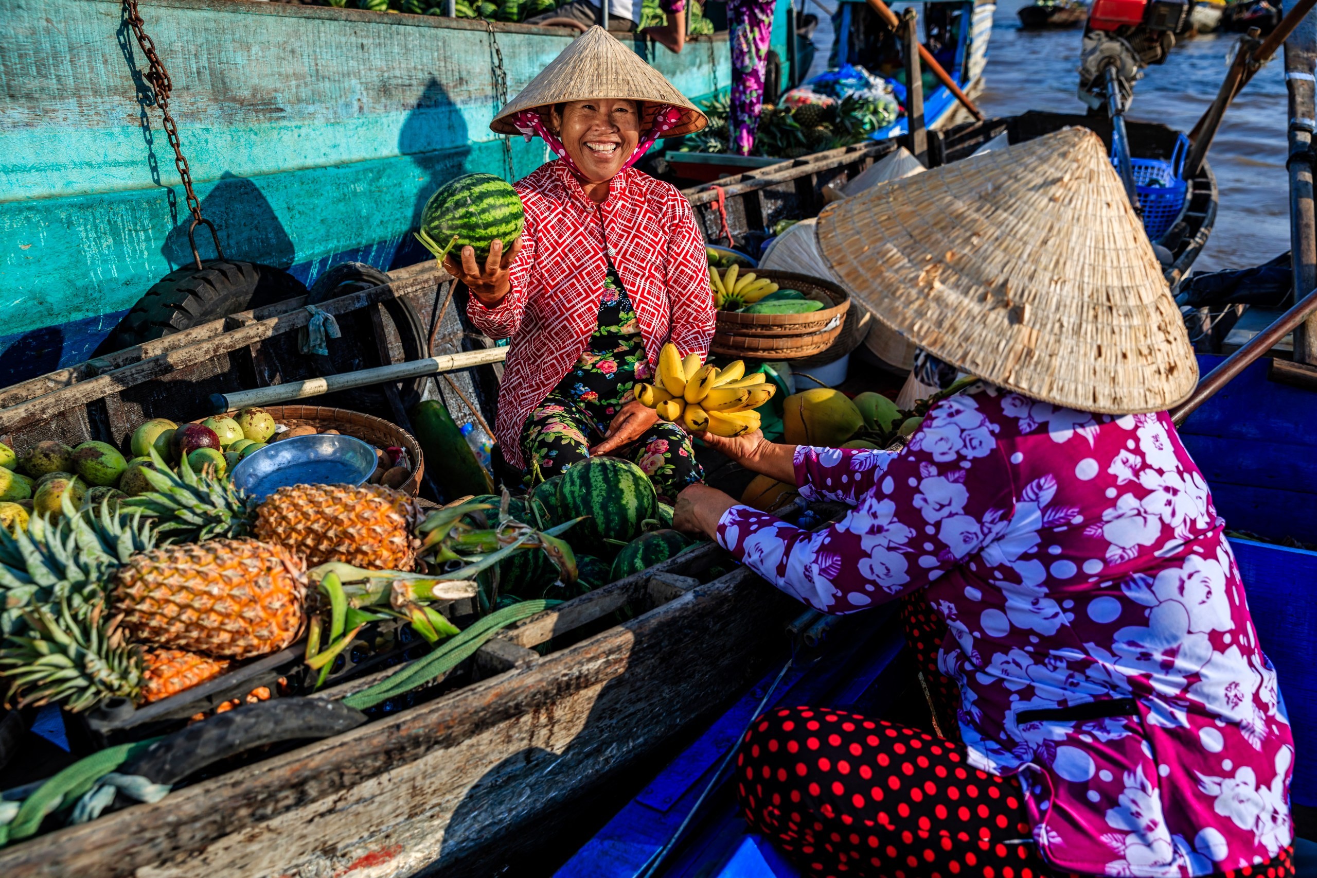 A fruit vendor at a floating market on the Mekong Delta (Getty Images)