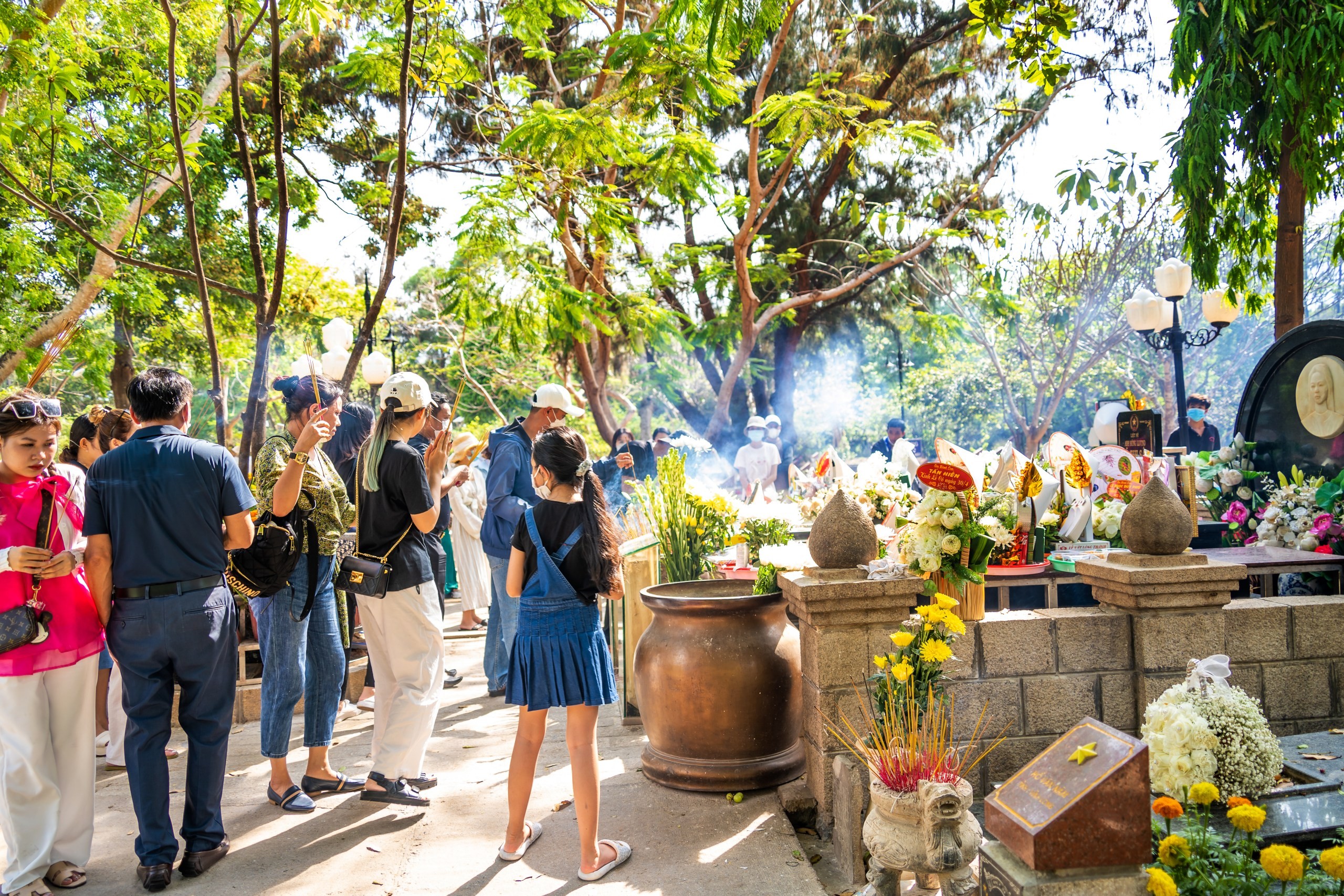 Vistiors at the cemetery on Con Dao island, Vietnam