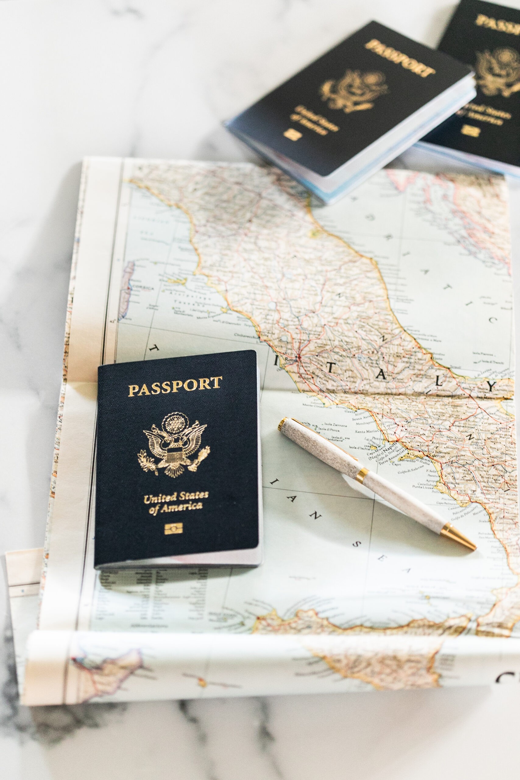 Passports and Map on Table with Pen for International Travel Planning