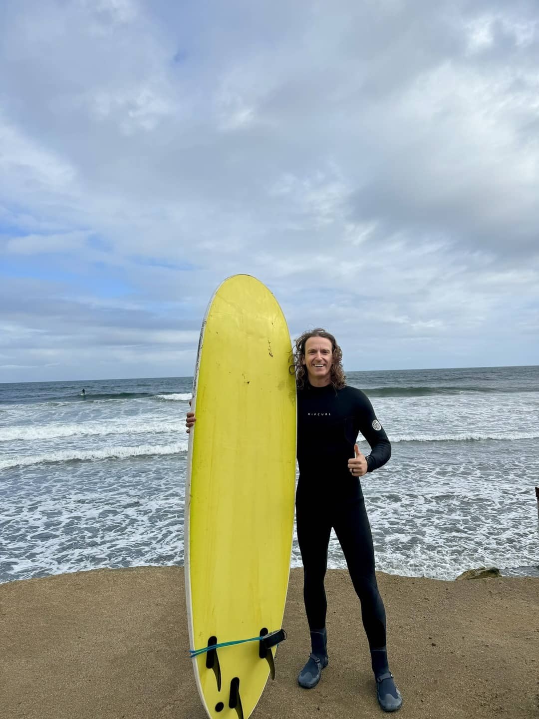 Surfing at La Boca, Concón, Chile, capturing the thrill of riding the waves against the backdrop of the Pacific Ocean