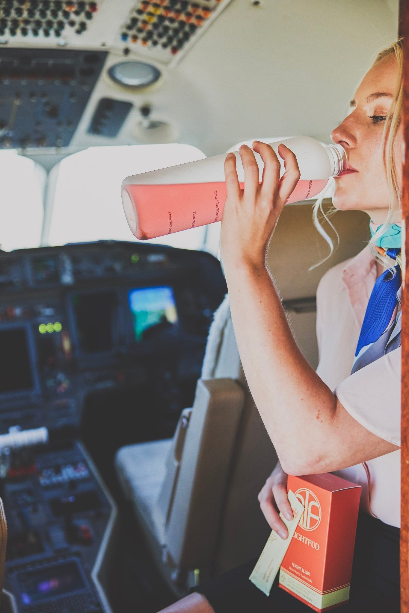 Traveler staying hydrated with a water bottle