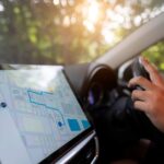 A person using a navigation app in a car