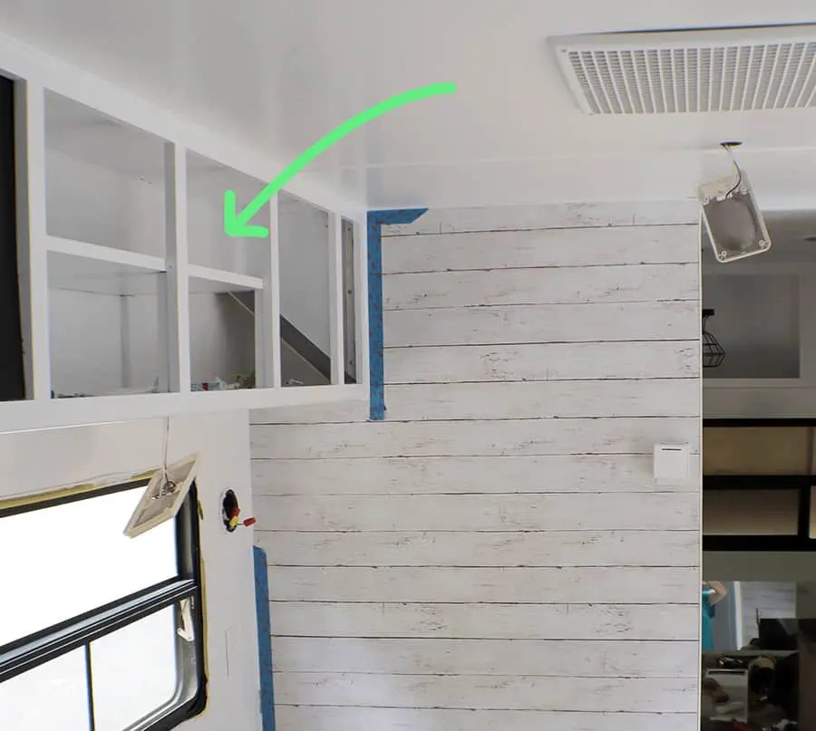 Custom-built cabinets in a remodeled travel trailer, maximizing storage space with clever design