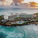 Turtle Bay Resort stands at the edge of a peninsula surrounded by turquoise water